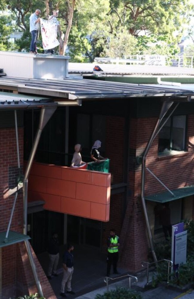 Activists on a rooftop at the University of Queensland as pro-Palestine protests continue. Picture: Liam Kidston