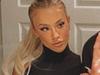 Tammy Hembrow poses on a Louis Vuitton beach towel worth $800 as she models  a racy G-string swimsuit