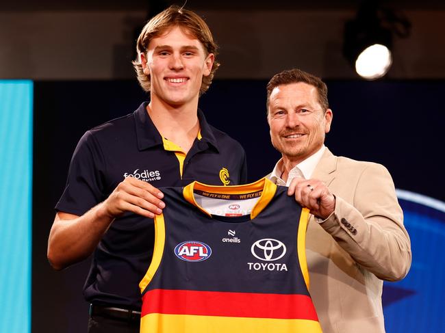 MELBOURNE, AUSTRALIA - NOVEMBER 20: Daniel Curtin is seen with Mark Bickley after being selected at number eight by the Adelaide Crows during the 2023 AFL Draft at Marvel Stadium on November 20, 2023 in Melbourne, Australia. (Photo by Michael Willson/AFL Photos via Getty Images)