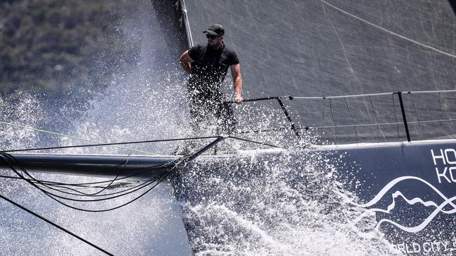 Crewman aboard Scallywag which won the race on the harbour. David Gray/AFP.