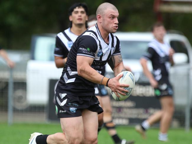 Picton’s Alec Susino takes on the line. Picture: Warren Gannon Photography