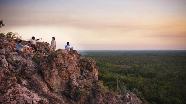 A group watch the sunset at Litchfield National Park. Picture: James Fisher/Tourism Australia