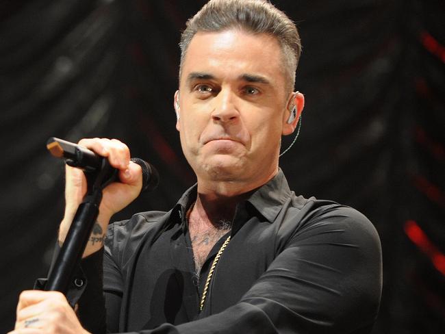 MANCHESTER, ENGLAND - DECEMBER 09: Robbie Williams performs on stage at Key 103 Christmas Live at Manchester Arena on December 9, 2016 in Manchester, England. (Photo by Shirlaine Forrest/Getty Images)