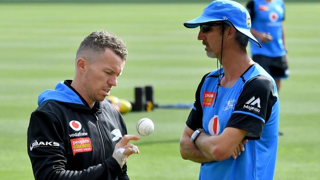 FOOD FOR THOUGHT: Adelaide Strikers coach Jason Gillespie (right) with fast bowler Peter Siddle at training at Adelaide Oval. Picture: SAM WUNDKE (AAP).