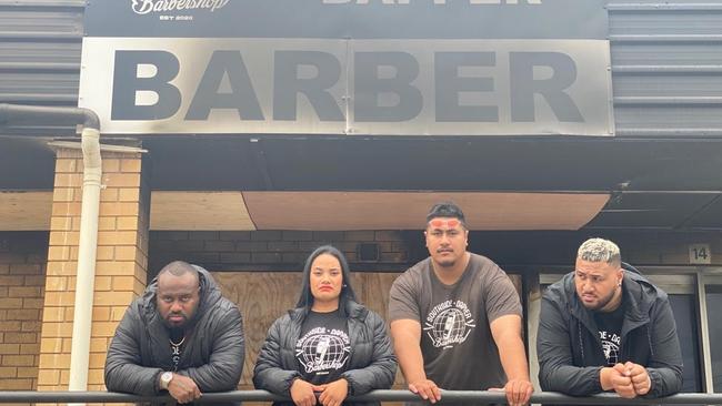 Vilisi Saqasaqa, Michelle Saqasaqa, Isaac Semau and Lennon Palau outside the burned out barber shop, which they plan to rebuild.