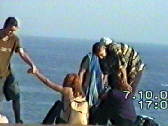 Police surveillance images showing Skaf, left, attempting to lure a group of girls off a beach moments before his arrest.