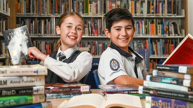 Pulteney Year 4 students Ava Mabikafola and Tom Karagiannis getting into their reading. Picture: NCA NewsWire / Naomi Jellicoe