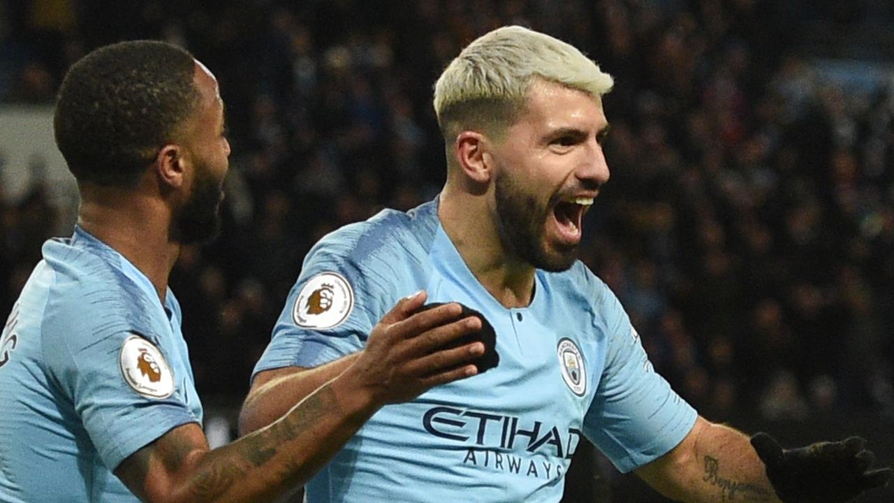 Manchester City's Argentinian striker Sergio Aguero (R) celebrates scoring their third goal to complete his hattrick during the English Premier League football match between Manchester City and Arsenal at the Etihad Stadium in Manchester, north west England, on February 3, 2019. (Photo by Oli SCARFF / AFP) / RESTRICTED TO EDITORIAL USE. No use with unauthorized audio, video, data, fixture lists, club/league logos or 'live' services. Online in-match use limited to 120 images. An additional 40 images may be used in extra time. No video emulation. Social media in-match use limited to 120 images. An additional 40 images may be used in extra time. No use in betting publications, games or single club/league/player publications. /