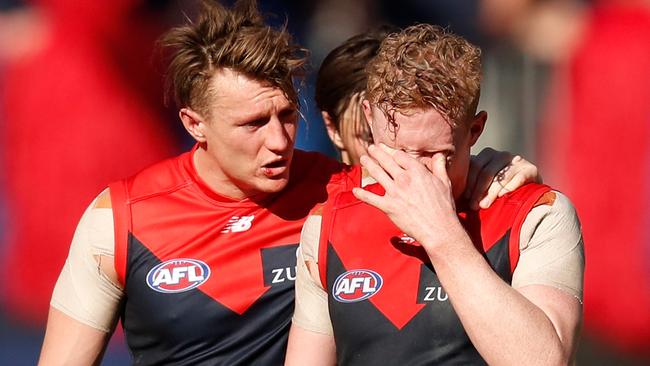 Aaron vandenBerg and Clayton Oliver after the Demons were smashed by West Coast in the 2018 preliminary final.