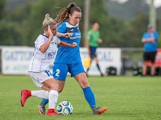 UNDER PRESSURE: South West Queensland Thunder midfielder Lana Styler (right) takes on the Gold Coast United defence. Picture: DSL Photography