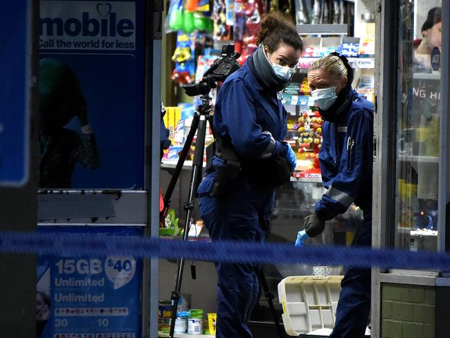 Forensic officers inside the milk bar. Picture: Nicole Garmston