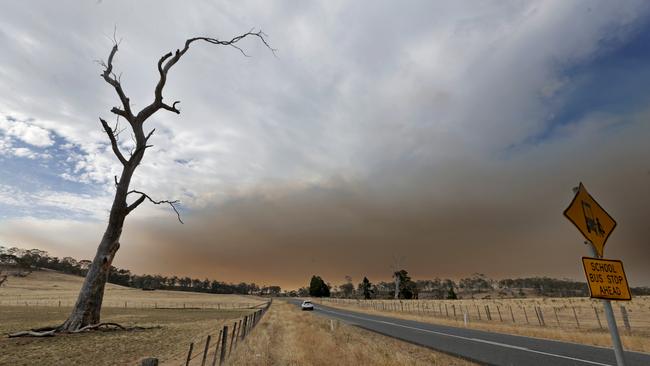 Smoke from the Central Highlands fires blows across farmland near Bothwell. Picture: PATRICK GEE