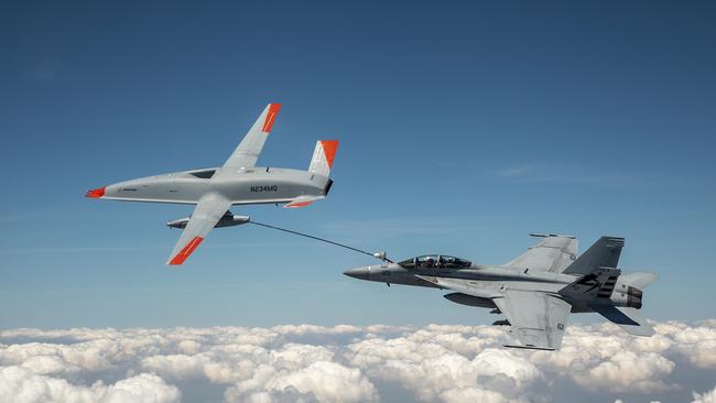 The Boeing MQ-25 T1 test asset transfers fuel to a U.S. Navy F/A-18 Super Hornet on June 4, marking the first time in history that an unmanned aircraft has refuelled another aircraft. Photo: Kevin Flynn