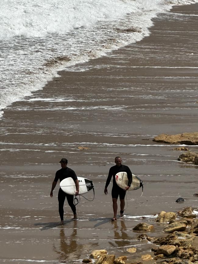 On a very windy day in Torquay, two surfers caught some amazing waves, and slowly made their way up the beach to the stairs to reach their car. Picture: Leanne Kapetanovski, Donvale.