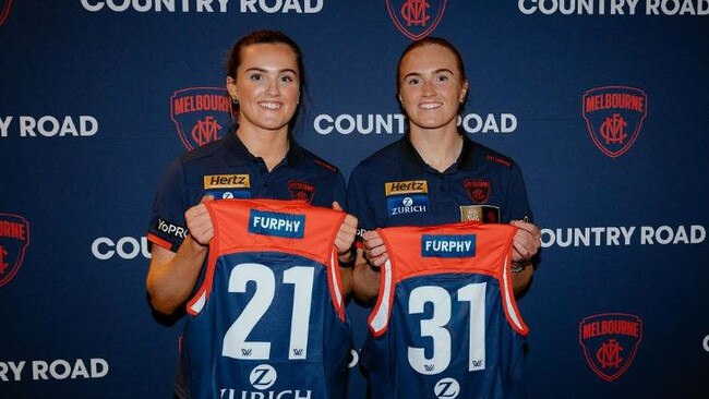 Melbourne debutant Aimee Mackin (left) will join her sister Blaithin in the side against Hawthorn on Friday night. Picture: Melbourne FC