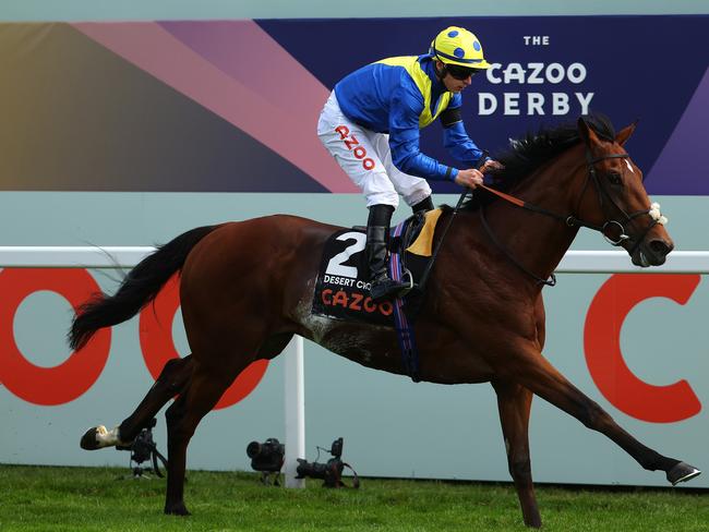 Richard Kingscote riding Desert Crown to victory in the Cazoo Derby. Picture: Getty Images.