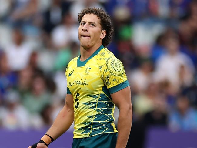 PARIS, FRANCE - JULY 24: Mark Nawaqanitawase #5 of Team Australia looks on during the Men's Rugby Sevens Pool B Group match between Australia and Kenya on Day -2 of the Olympic Games Paris 2024 at Stade de France on July 24, 2024 in Paris, France. (Photo by Cameron Spencer/Getty Images)