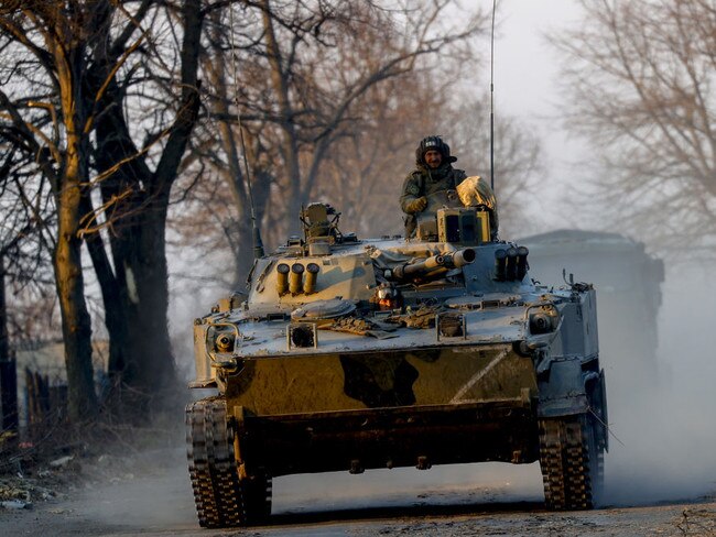 Russian military vehicles patrol in Volnovakha city, one of the cities most affected by the war between Russia and Ukraine. Reports have claimed some troops have resorted to eating dogs over rations.