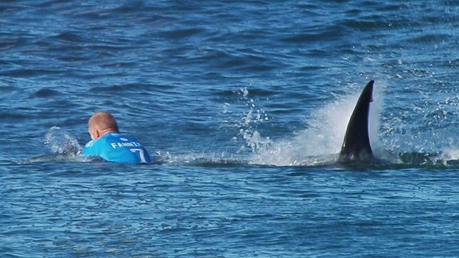 Fanning is pursued by a shark, in Jeffrey's Bay, South Africa.