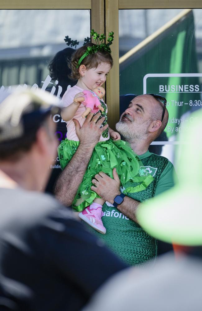 Ida Mulvaney gets a good view of the Darling Downs Irish Club St Patrick's Day parade courtesy of dad Graham Mulvaney, Sunday, March 16, 2025. Picture: Kevin Farmer