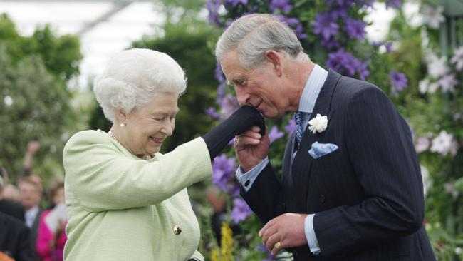 Good humour: with the Queen in 2009. Picture: Getty Images