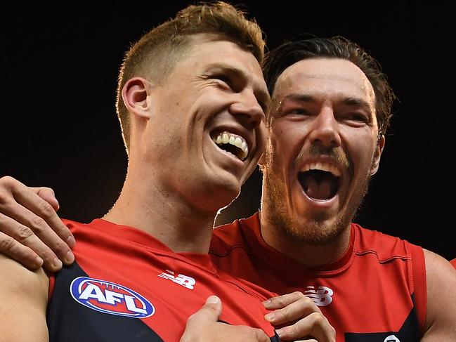 Jake Melksham (left) and Michael Hibberd of the Demons react after the First Semi Final between the Hawthorn Hawks and the Melbourne Demons in Week 2 of the AFL Finals Series at the MCG in Melbourne, Friday, September 14, 2018. (AAP Image/Julian Smith) NO ARCHIVING, EDITORIAL USE ONLY