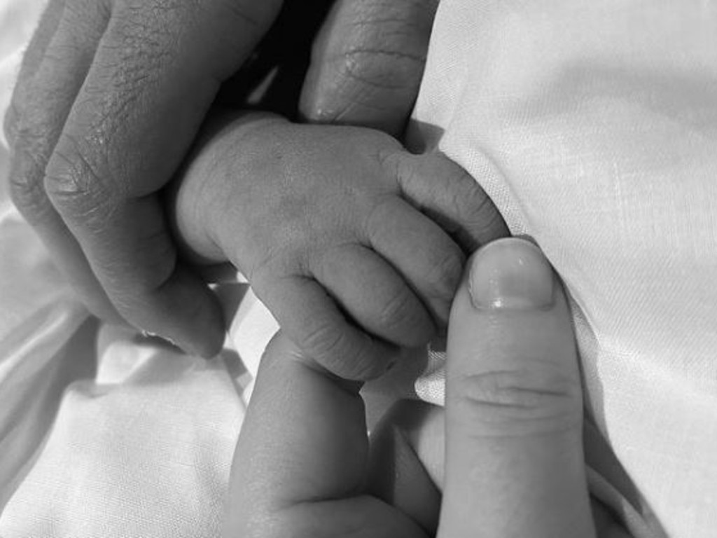 Princess Eugenie posted a photo of her and husband Jack Brooksbank holding their new baby's hand. Picture: Instagram