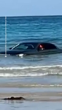 BMW driver told ‘you can’t park there’ as car floats out to sea