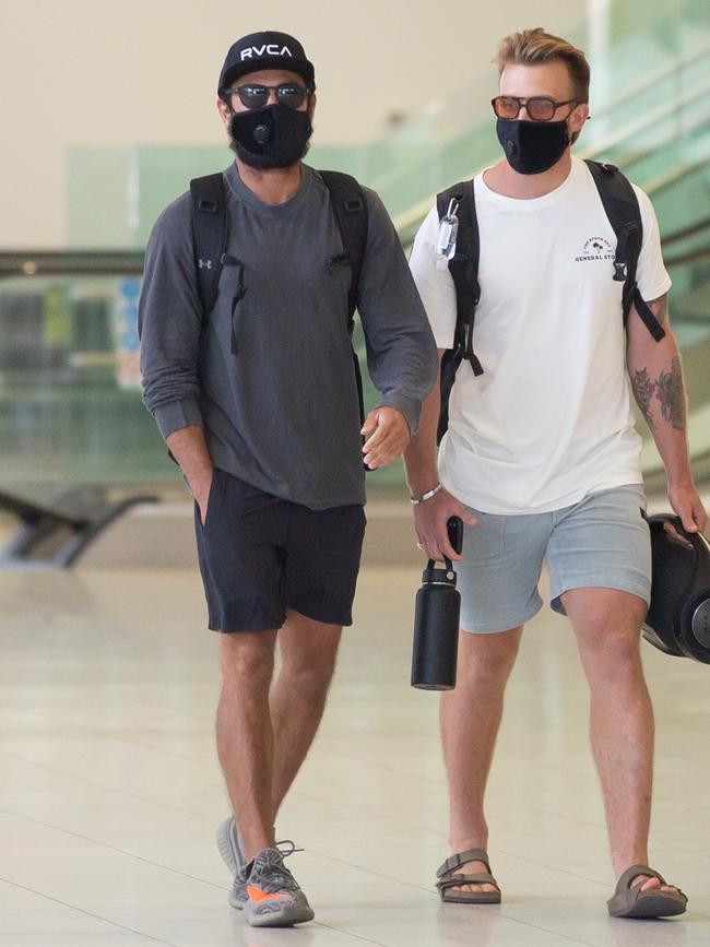 Hollywood star Zac Efron, left, arriving at the Adelaide Airport today.