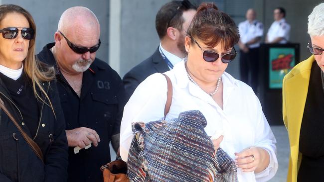 Brett and Belinda Beasley leave the Supreme Court in Brisbane surrounded by supporters. Picture: NCA NewsWire/ Richard Gosling