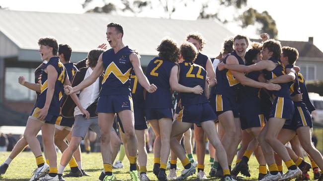 MELBOURNE, AUSTRALIA - AUGUST 03: Lochie Reidy of Whitefriars College (4L) and teammates celebrate on the final siren after winning the Herald Sun Shield Senior Boys Grand Final between Whitefriars College and St Patrick's Ballarat at Box Hill City Oval on August 03, 2022 in Melbourne, Australia. (Photo by Daniel Pockett/AFL Photos/via Getty Images)