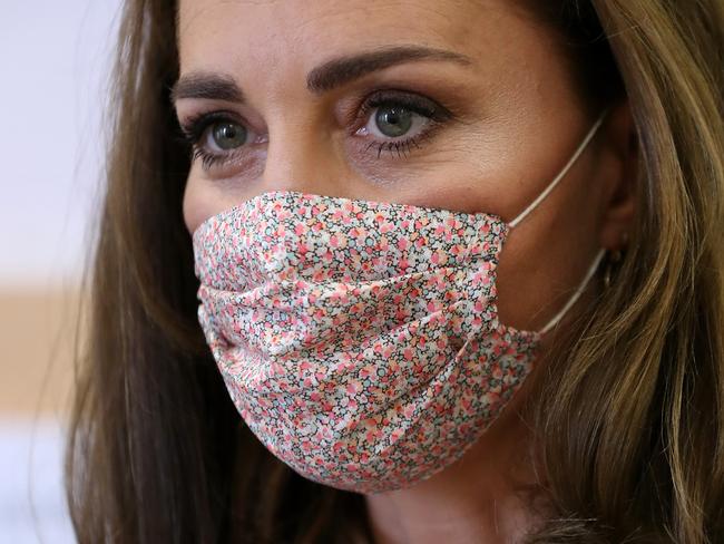 Even royalty is wearing face masks. Picture: AFP.