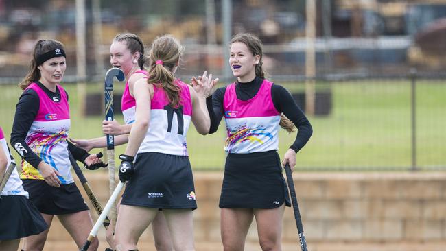 Leigh Thomas (right) celebrates her goal for Gold Coast against Tweed in Hockey Queensland Championships at Clyde Park, Sunday, May 2, 2021. Picture: Kevin Farmer