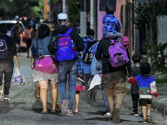 Migrants begin walking in a caravan in San Pedro Sula, Honduras. Picture: AFP