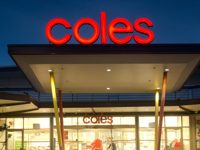 Sydney, Australia - July 25, 2013: The entrance to a brightly lit Coles supermarket in Ropes Crossing at dusk.