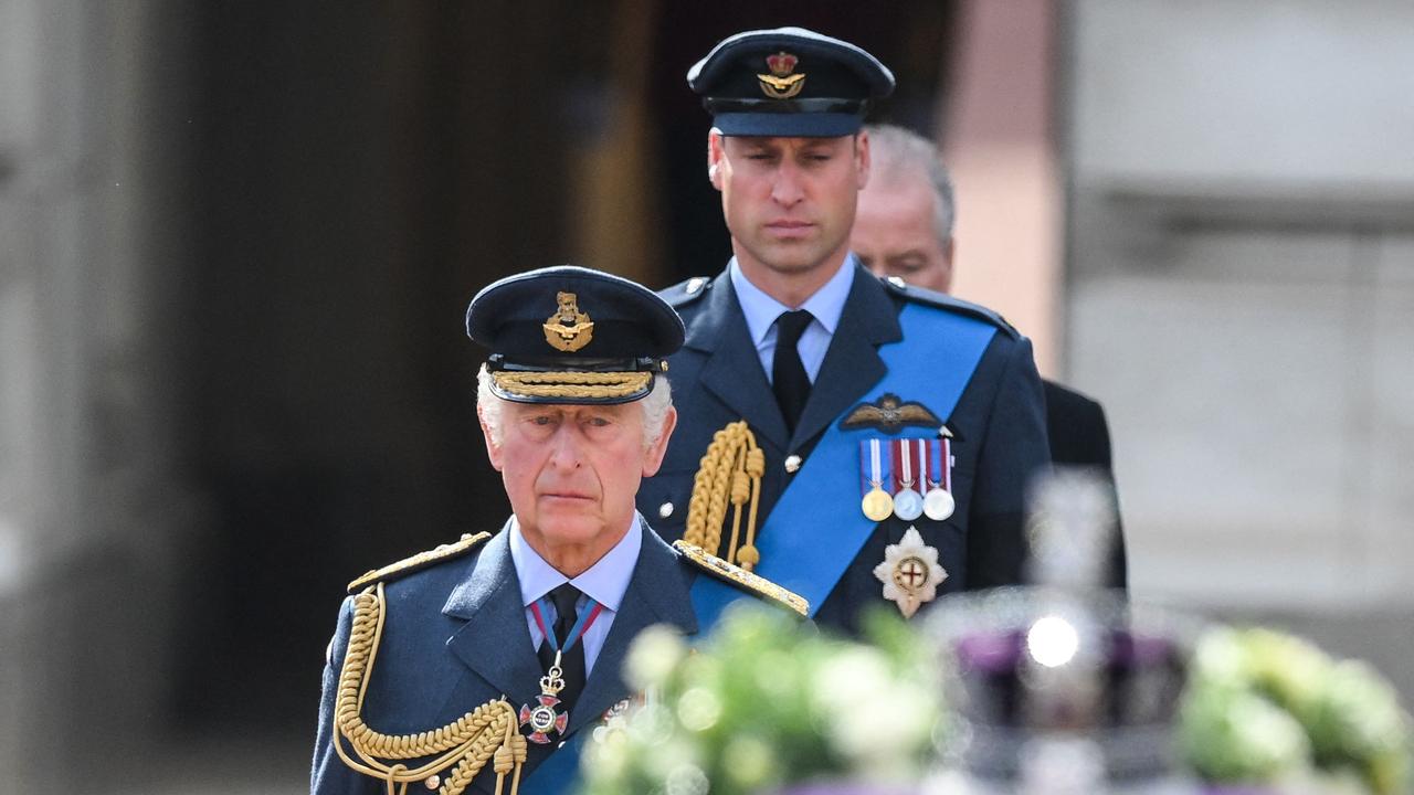 King Charles III and Prince William, Prince of Wales walk behind the coffin of Queen Elizabeth II. (Photo by Daniel LEAL / POOL / AFP)