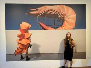 HEATWAVE: Bundaberg Regional Gallery curator, Anita Holtsclaw with Gerwyn Davies' leading artwork in the exhibition, Prawn. Picture: Rhylea Millar