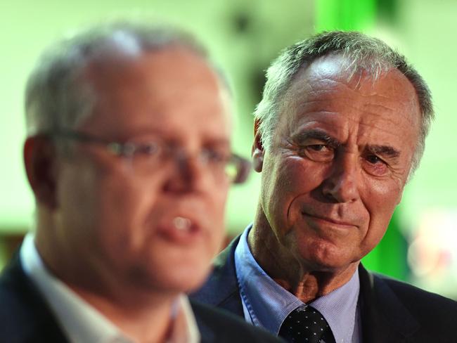 Liberal candidate for Bennelong John Alexander listens to Treasurer Scott Morrison at a press conference in North Ryde on Monday. Picture: Mick Tsikas