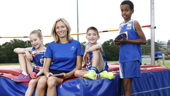 Canterbury Little Athletics member Riley Dickey, Club President Ljiljana Sentas and club members Harrison Davies and Fuad Ogle. The club got a federal grant for a high jump storage cage. Picture: Richard Dobson