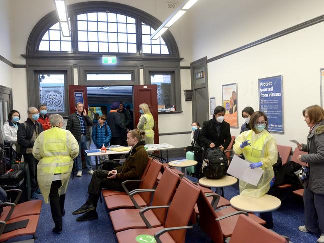 Health staff meet passengers arriving on the XPT train from Albury at Sydney’s Central. Picture: NCA NewsWire / Jeremy Piper