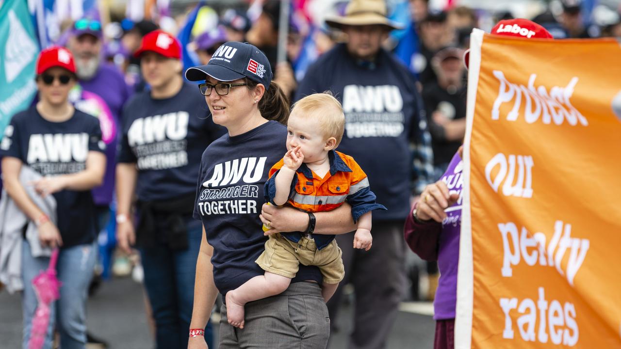 Haidee Janetzki holding her son Patrick Janetzki listens to the speeches at the Labour Day 2022 Toowoomba march, Saturday, April 30, 2022. Picture: Kevin Farmer