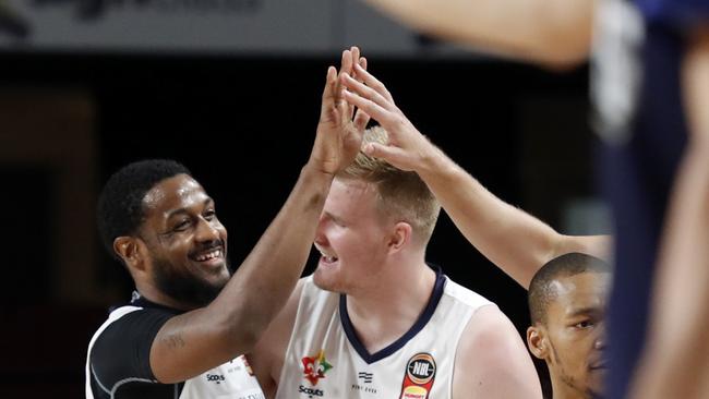 Ramone Moore and Harry Froling of the 36ers celebrate during the Round 13 NBL match between Adelaide United and Perth Wildcats at the Adelaide Entertainment Centre in Adelaide, Wednesday, January 1, 2020. (AAP Image/Kelly Barnes) NO ARCHIVING, EDITORIAL USE ONLY