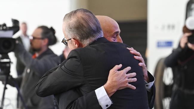 Prime Minister Anthony Albanese embraces Walter Mikac at the National Museum of Australia to mark the museum's acquisition. Picture: NCA NewsWire / Martin Ollman