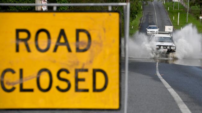 Dairy Creek road in Logan Village is closed for flooding. AAP image, John Gass