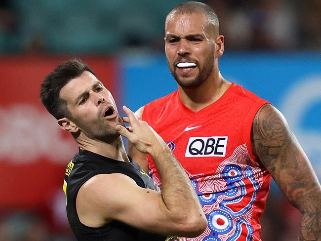 Sydney's Lance Franklin elbows Richmond's Trent Cotchin during the Marn Grook match for Sir Doug Nicholls Round between the Sydney Swans and Richmond Tigers at the SCG. Photo by Phil Hillyard (Image Supplied for Editorial Use only - **NO ON SALES** - Â©Phil Hillyard )