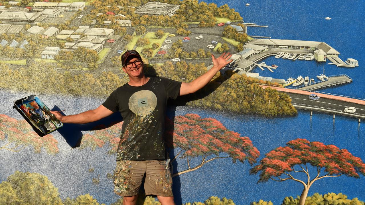 Andrew Grassi Kelaher in front of his new mural in Tewantin