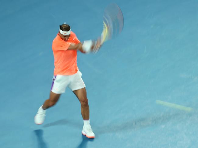 MELBOURNE, AUSTRALIA - FEBRUARY 11: Rafael Nadal of Spain plays a backhand in his Men's Singles second round match against Michael Mmoh of the United States during day four of the 2021 Australian Open at Melbourne Park on February 11, 2021 in Melbourne, Australia. (Photo by Mark Metcalfe/Getty Images)