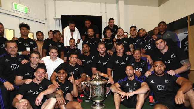 The All Blacks pose with the Bledisloe Cup at Eden Park.