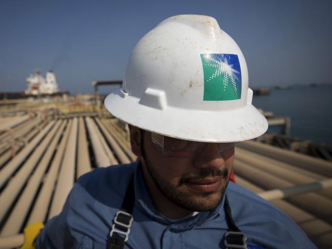 An employee stands near pipes used for landing and unloading crude and refined oil at the North Pier Terminal, operated by Saudi Aramco, in Ras Tanura, Saudi Arabia, on Monday, Oct. 1, 2018. Saudi Aramco aims to become a global refiner and chemical maker, seeking to profit from parts of the oil industry where demand is growing the fastest while also underpinning the kingdom’s economic diversification. Photographer: Simon Dawson/Bloomberg