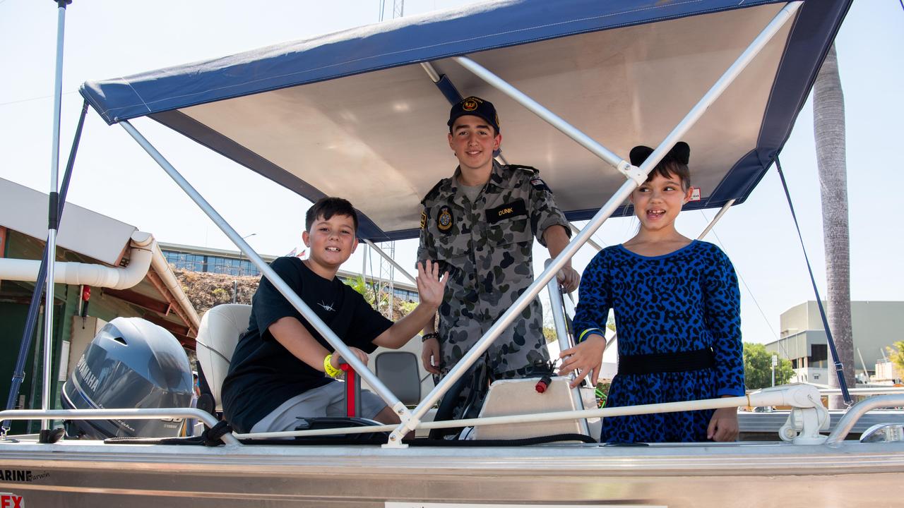 Arabeela, Alexander and Scott Dunk at the first HMAS Coonawarra open day in seven years. Picture: Pema Tamang Pakhrin